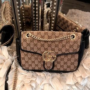 This Gucci GG Crossbody gold chain bag is a must have only worn it about 4 times